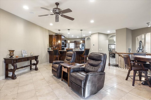 living room featuring ceiling fan