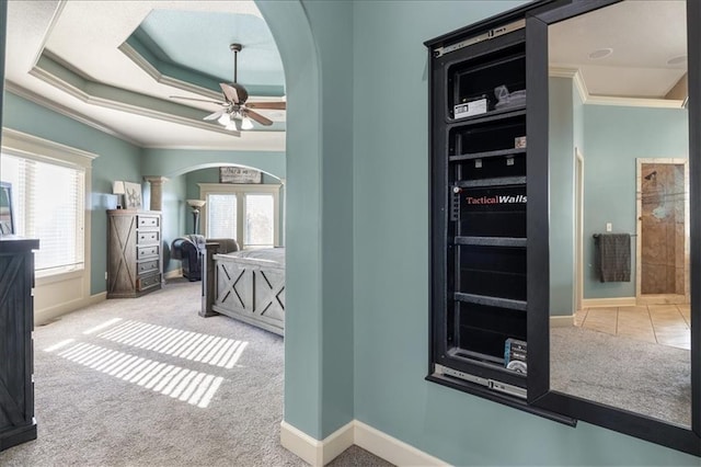 hall with light carpet and ornamental molding