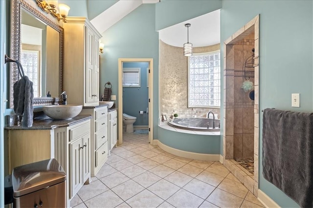 full bathroom featuring separate shower and tub, tile patterned floors, toilet, vaulted ceiling, and vanity