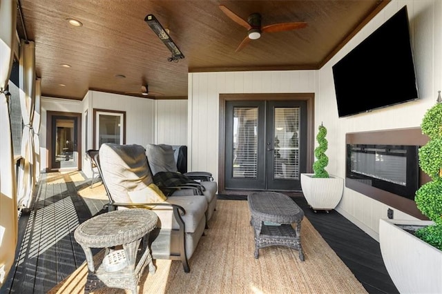 view of patio featuring french doors and ceiling fan