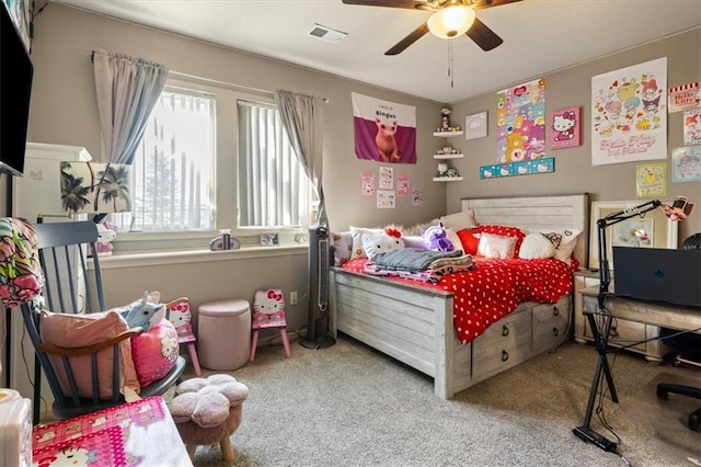 bedroom with ceiling fan and carpet floors