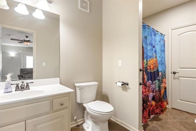 bathroom with toilet, vanity, tile patterned flooring, and ceiling fan