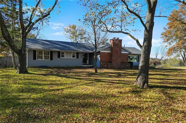 ranch-style home with a front lawn