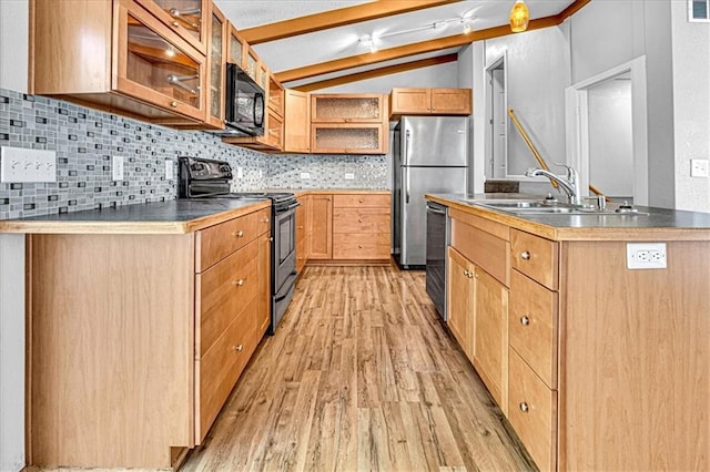 kitchen with black appliances, sink, vaulted ceiling, light wood-type flooring, and tasteful backsplash