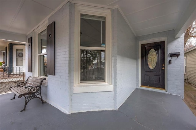 doorway to property featuring a porch