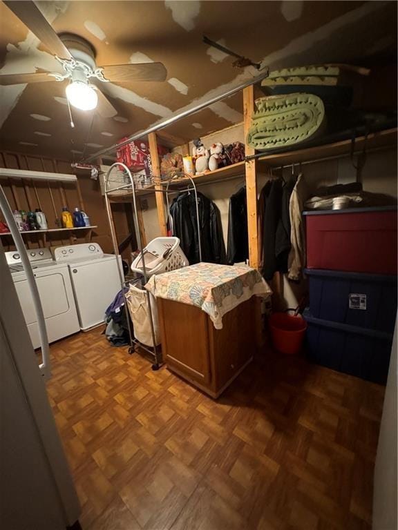 storage area with washing machine and clothes dryer and ceiling fan