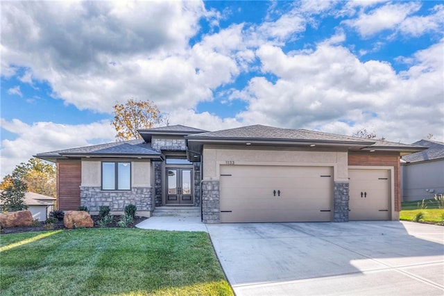 prairie-style home with a garage and a front yard