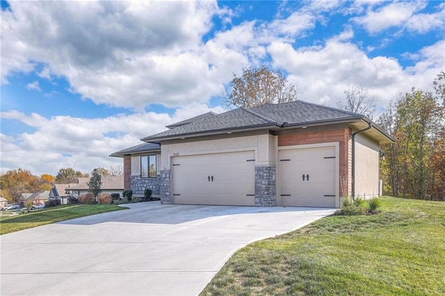 view of front of property with a front lawn and a garage