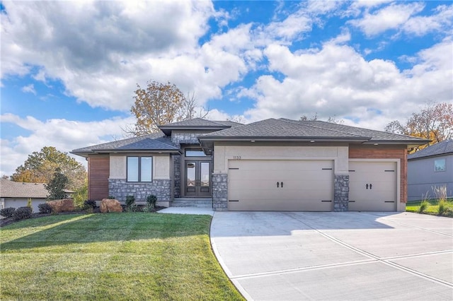 prairie-style house with a front lawn and a garage