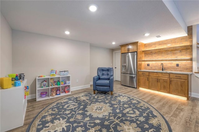 interior space featuring light hardwood / wood-style floors and sink