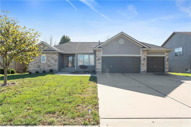 ranch-style home featuring a garage and a front lawn