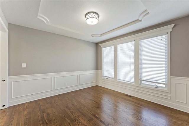 unfurnished room featuring dark hardwood / wood-style flooring