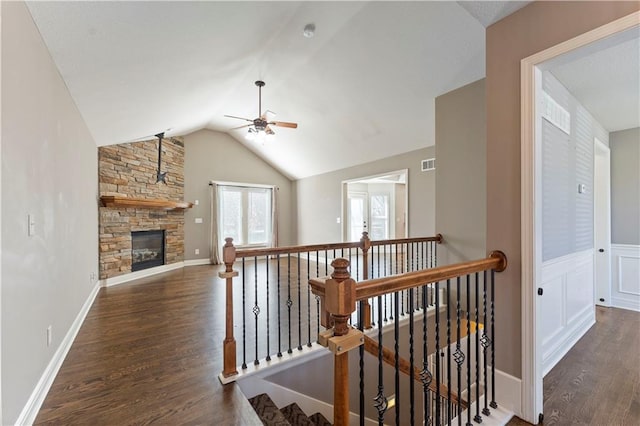 corridor with french doors, dark hardwood / wood-style floors, and vaulted ceiling