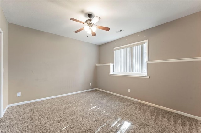 empty room with carpet and ceiling fan