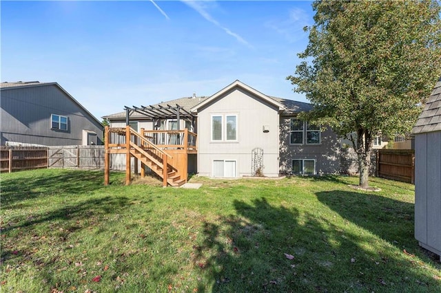 back of property with a pergola and a yard