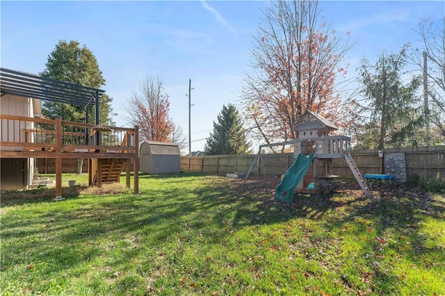 view of yard with a playground and a shed