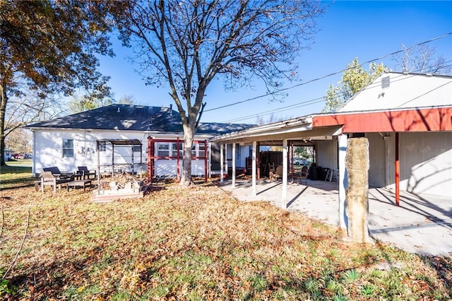 back of property featuring a patio