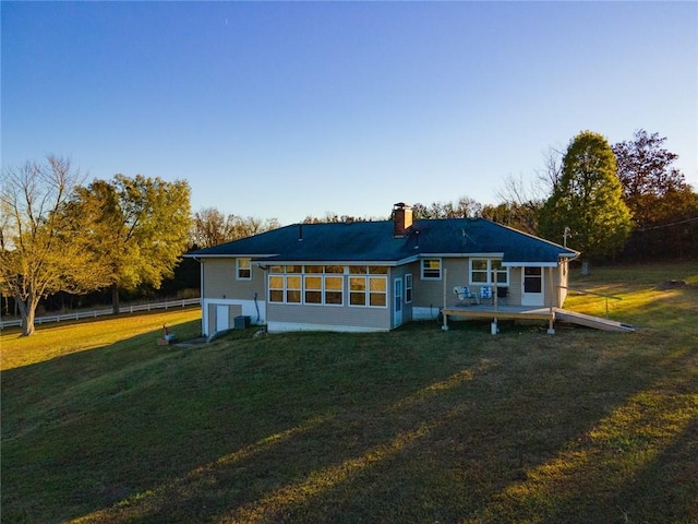 rear view of house with a lawn