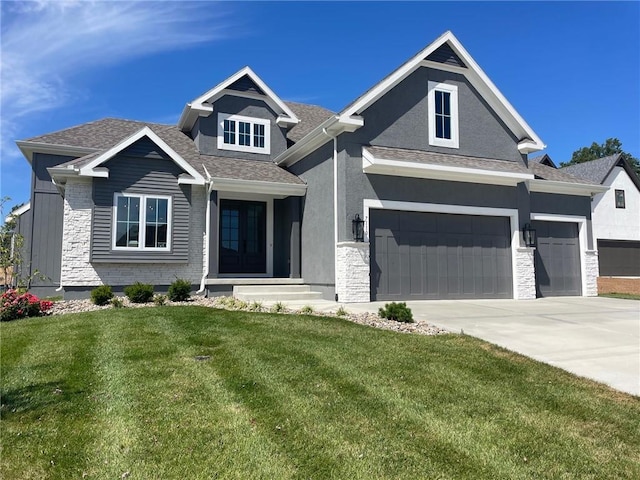 view of front of house featuring a garage and a front yard