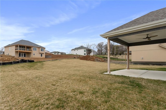 view of yard with a patio and ceiling fan