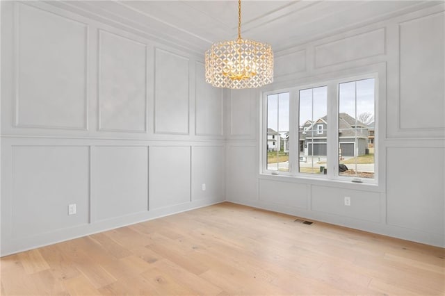 unfurnished dining area with light hardwood / wood-style floors