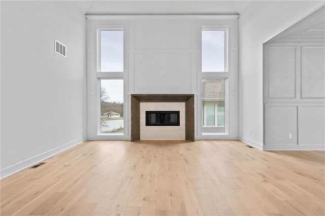 unfurnished living room featuring light hardwood / wood-style floors