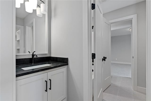 bathroom featuring tile patterned flooring and vanity