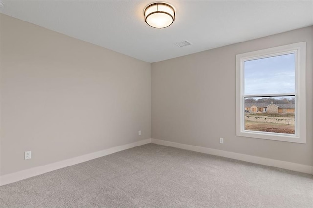 spare room featuring carpet floors