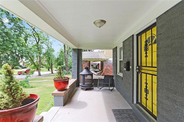 6206 Harrison St, Kansas City, MO 64110 - view of patio / terrace featuring covered porch