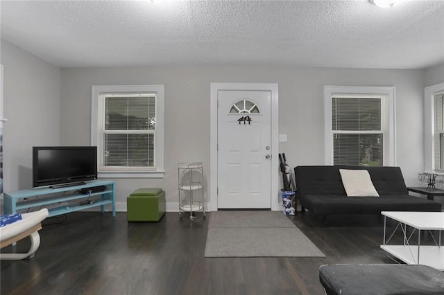 6206 Harrison St, Kansas City, MO 64110 - living room with wood finished floors and a textured ceiling