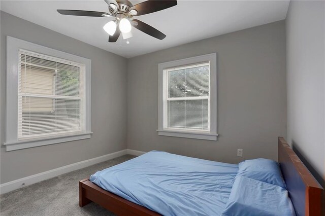 6206 Harrison St, Kansas City, MO 64110 - bedroom with baseboards, carpet flooring, and ceiling fan