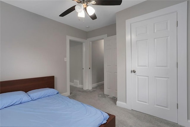 carpeted bedroom featuring ceiling fan