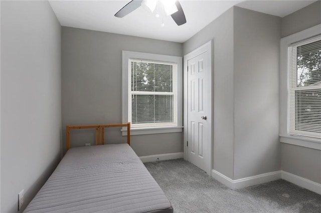 bedroom featuring ceiling fan and light colored carpet