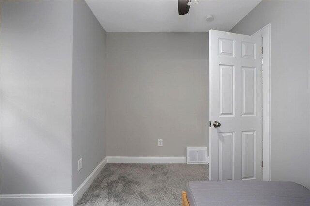 6206 Harrison St, Kansas City, MO 64110 - carpeted bedroom with baseboards and ceiling fan