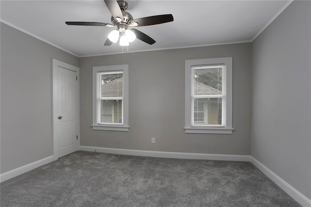 carpeted empty room with ceiling fan and ornamental molding