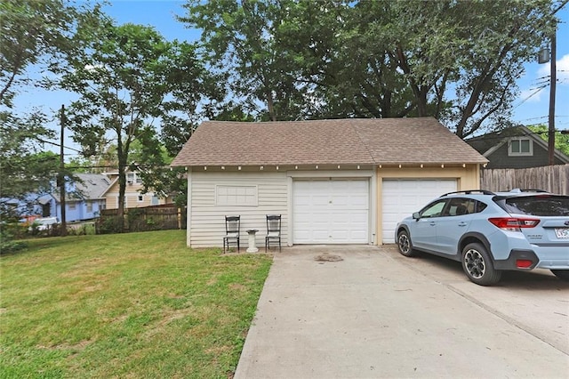 garage with a yard