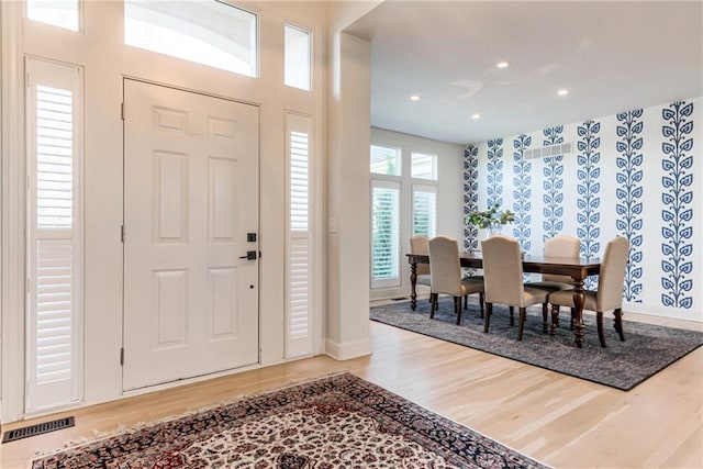 foyer with wood-type flooring