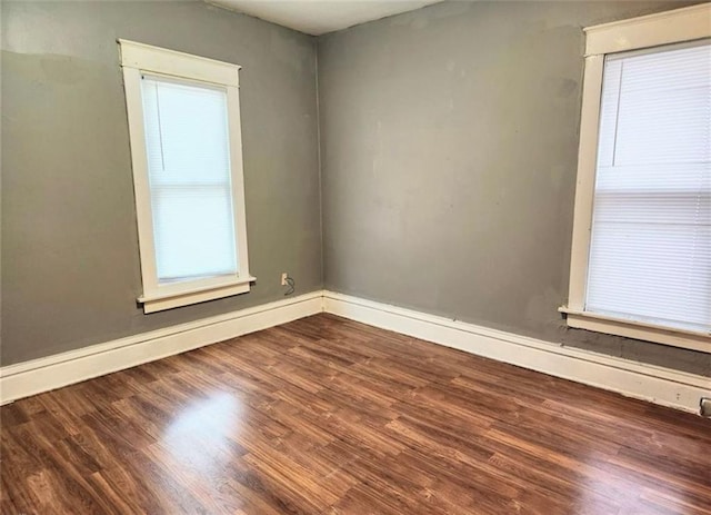 empty room with wood-type flooring