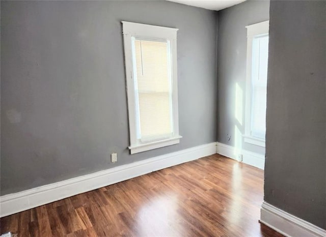 empty room featuring wood-type flooring