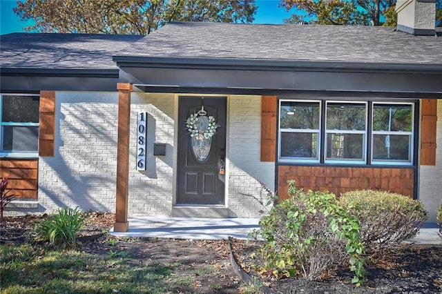 doorway to property featuring a porch