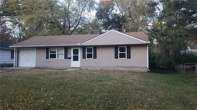 view of front of house featuring a garage and a front yard