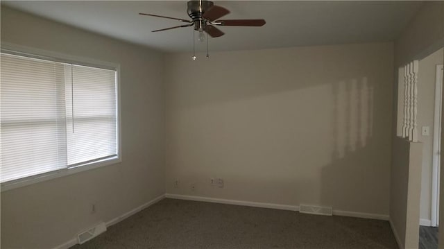 carpeted empty room featuring ceiling fan