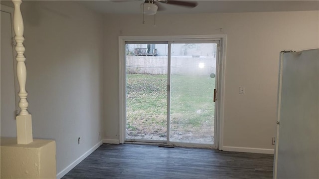 interior space with dark wood-type flooring and ceiling fan