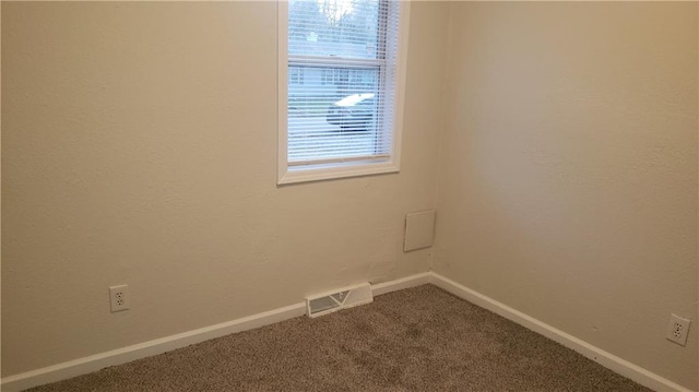 unfurnished room featuring carpet flooring