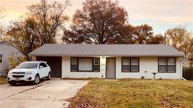 7714 E 110th St, Kansas City, MO 64134 - ranch-style house featuring an attached garage, driveway, a front lawn, a chimney, and roof with shingles