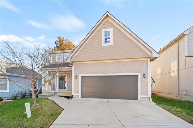 view of front of property with a garage and a front yard