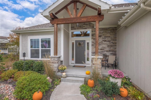 view of exterior entry with covered porch