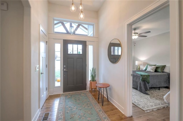 entryway featuring ceiling fan and light hardwood / wood-style flooring