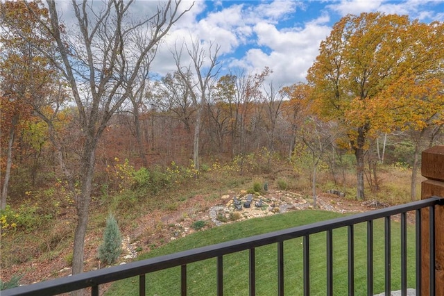 view of yard with a balcony