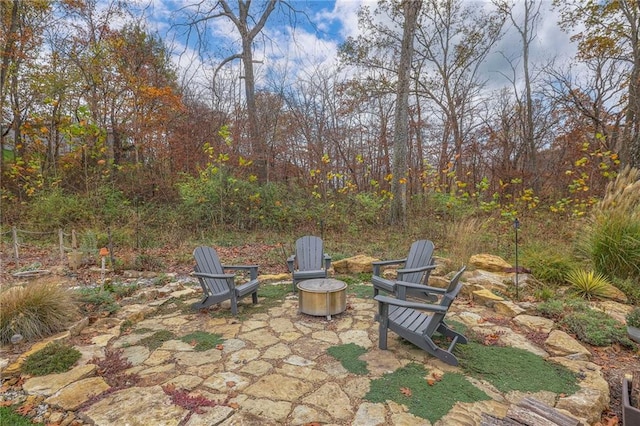 view of patio with a fire pit